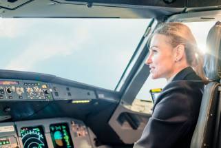 Employee story: Woman at the controls of an airplane